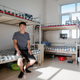 Hou Jie, 24, is a maintenance worker at the mine. He shares this dorm room onsite with seven other employees.